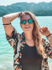 Portrait of young woman wearing sunglasses