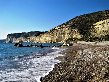 Scenic view of sea against clear blue sky