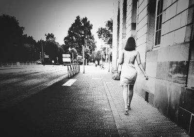 People walking in front of building