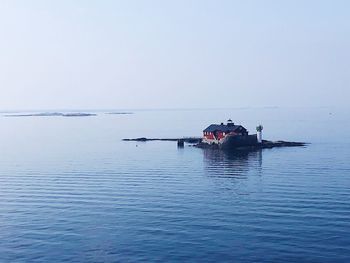 Boat in sea against clear sky