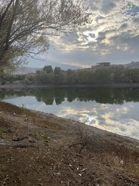 Scenic view of lake against sky during sunset