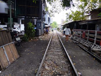 Rear view of railroad tracks in city