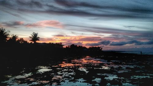 Scenic view of sea against dramatic sky