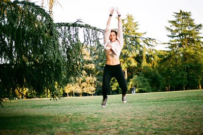 Full length of young woman in park