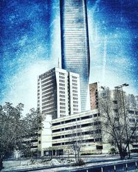 Low angle view of buildings against blue sky