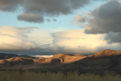 Scenic view of landscape against sky during sunset