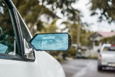 Close-up of car on road