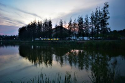 Scenic view of lake against sky at sunset