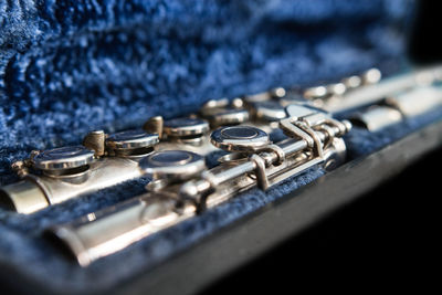 Close-up of musical instrument in blue container