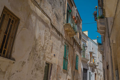 Low angle view of old buildings against sky