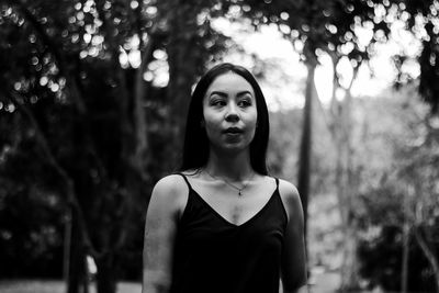 Young woman standing at park