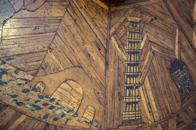 High angle view of carving on hardwood floor