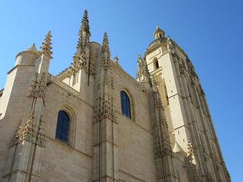 Low angle view of church against blue sky