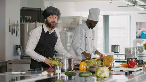 Portrait of young man working at table