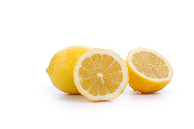 Close-up of orange fruit against white background