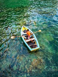 High angle view of boat floating in lake