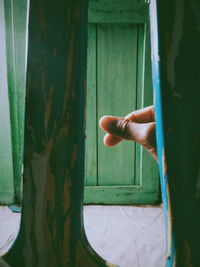 Human hand holding open door