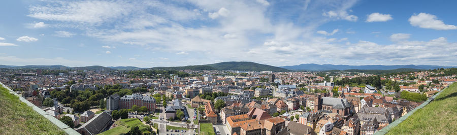 High angle view of townscape against cloudy sky