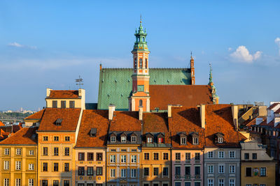 Buildings in city against sky