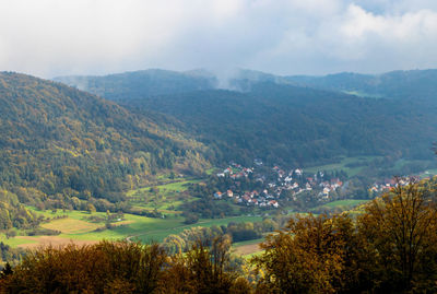 Scenic view of landscape and mountains against sky