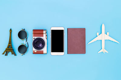 Directly above shot of telephone booth against blue background