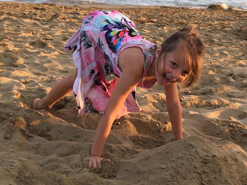 land, child, real people, childhood, sand, leisure activity, girls, lifestyles, one person, full length, women, females, beach, nature, day, playing, sunlight, innocence, outdoors