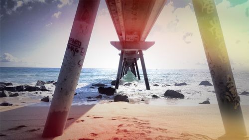 Underneath view of pier over sea