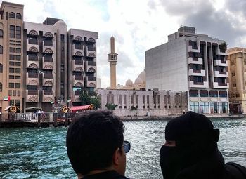 Buildings in city against clear sky