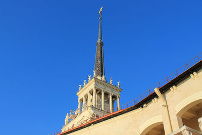 Low angle view of historical building against blue sky