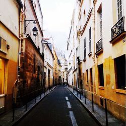 Narrow alley with buildings in background