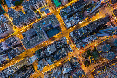 High angle view of illuminated street amidst buildings in city