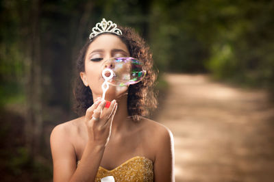 Portrait of a girl holding camera