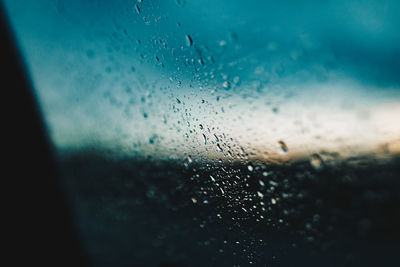 Close-up of raindrops on glass window