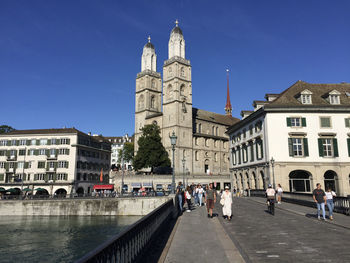 The grossmünster protestant church seen from the münsterbrücke historic bridge in zürich,switzerland 