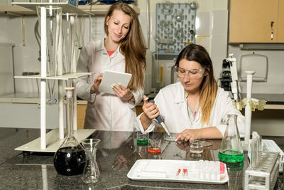 Happy young woman looking at camera