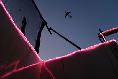 Low angle view of airplane flying in sky