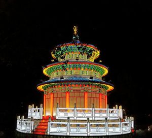 Low angle view of illuminated building at night