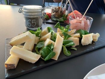 High angle view of chopped vegetables in plate on table