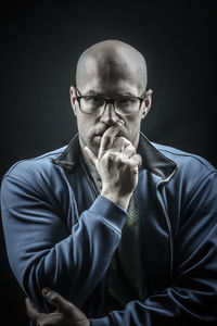 Mid adult man looking away over white background