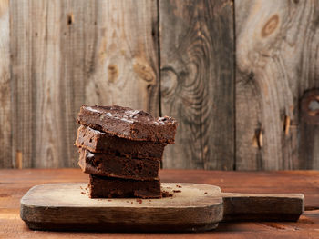 Close-up of chocolate cake on wooden table