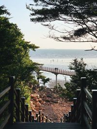 Bridge over sea against sky