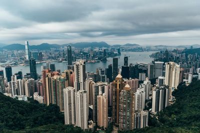 Aerial view of modern buildings in city against sky