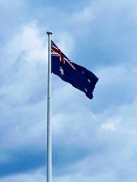 Low angle view of flag against sky