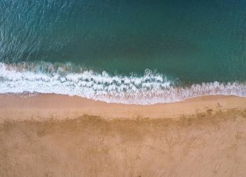 Close-up of sand against sky