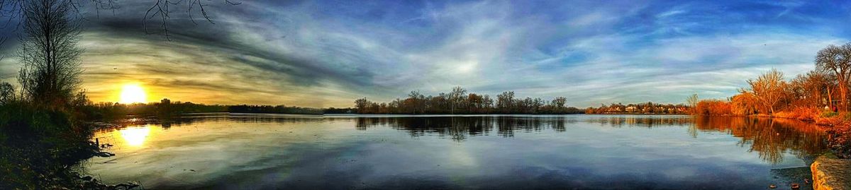 Scenic view of lake at sunset