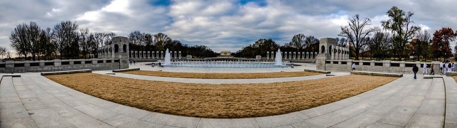 Panoramic view of park against cloudy sky