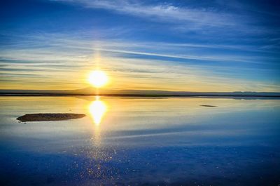 Scenic view of calm sea at sunset