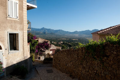 Houses in town against clear sky