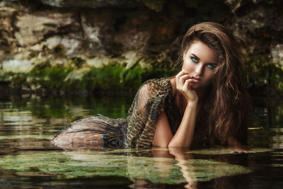 Portrait of beautiful woman in water