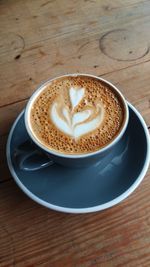 Close-up of cappuccino on table